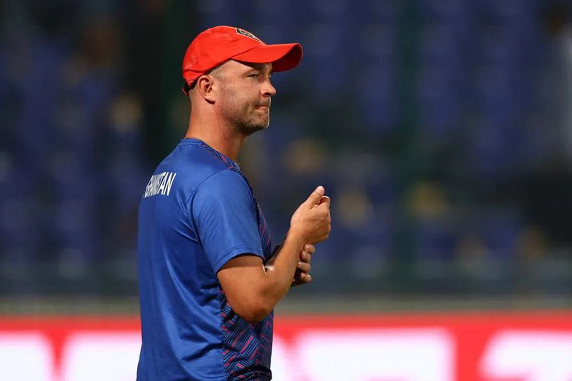 Cricket - ICC Cricket World Cup 2023 - England v Afghanistan - Arun Jaitley Stadium, New Delhi, India - October 15, 2023 Afghanistan coach Jonathan Trott celebrates after the match REUTERS/Andrew Boyers