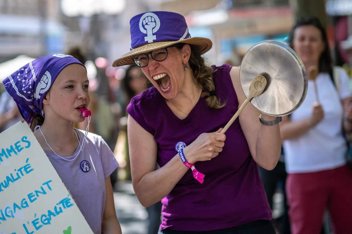 Women demonstrate for equal pay in Lausanne, Switzerland, in June 2023.