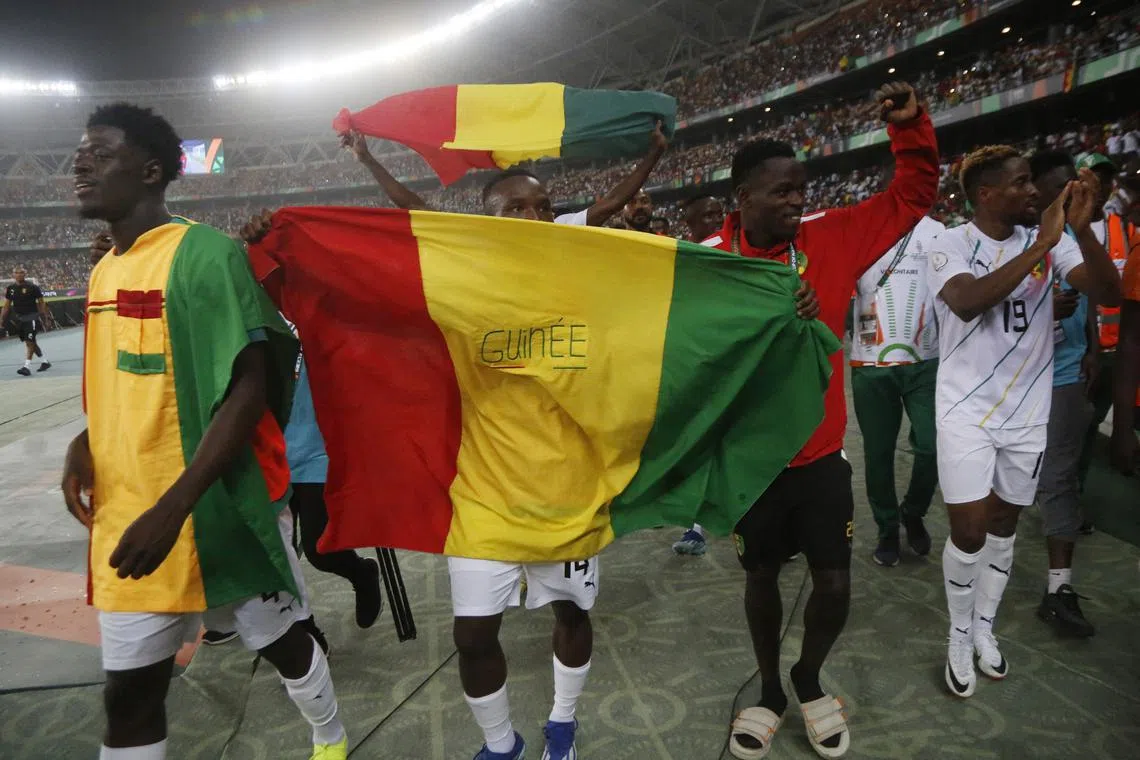Soccer Football - Africa Cup of Nations - Round of 16 - Equatorial Guinea v Guinea - Olympic Stadium of Ebimpe, Abidjan, Ivory Coast - January 28, 2024 Guinea's Karim Cisse with teammates celebrate after the match REUTERS/Luc Gnago/File Photo