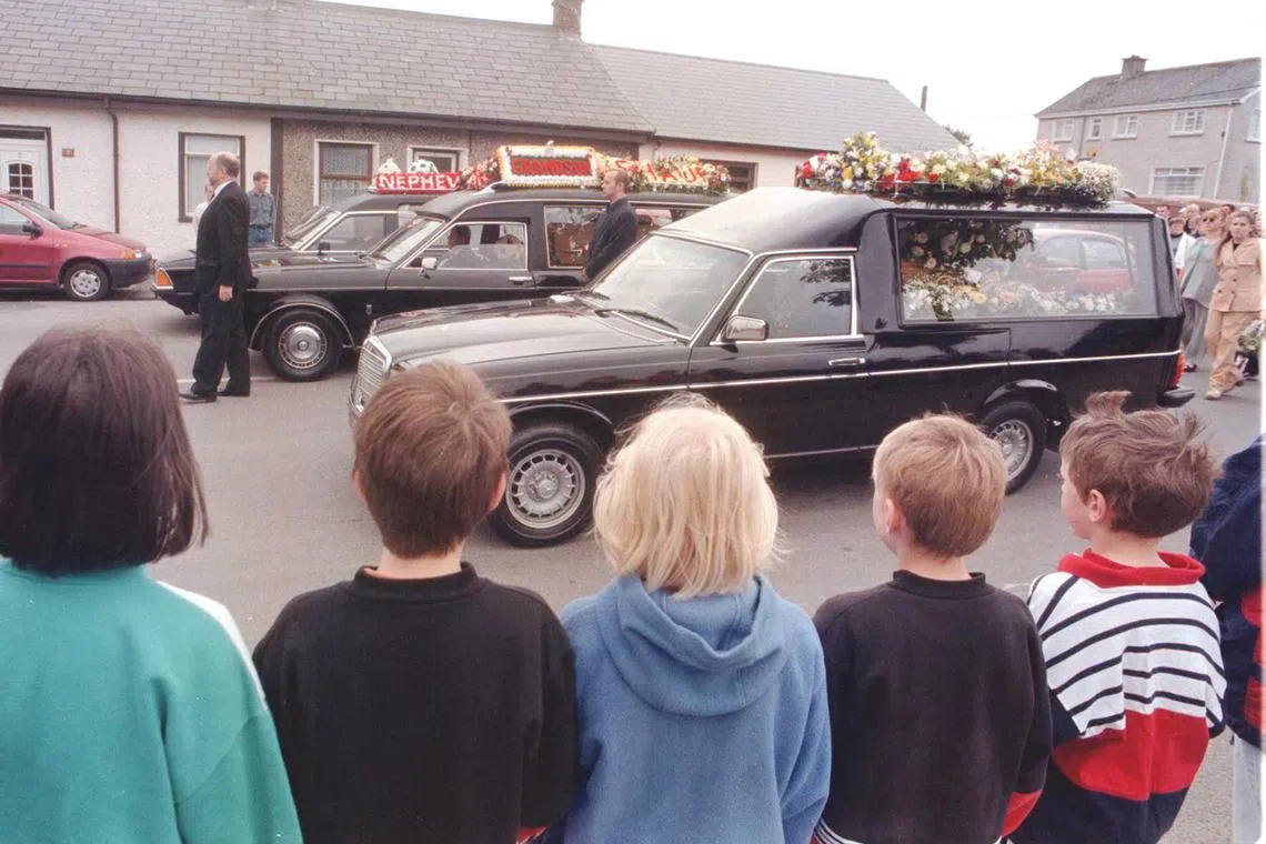 A memorial service and procession for victims of a bomb blast in Omagh, Northern Ireland, on Aug 19, 1998.