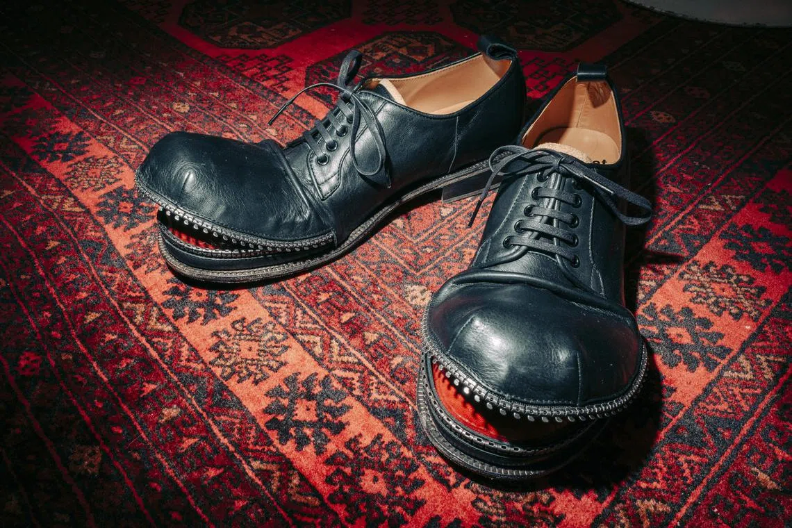 Shoes designed by Shintaro Yamamoto, the designer of Kids Love Gaite, at his studio in Tokyo, Feb 21, 2025. For the shoes with metallic teeth that Shintaro Yamamoto designed for the Japanese label Doublet, he hand-stitched the upper “jaw” so that it stayed open. (Kentaro Takahashi/The New York Times)