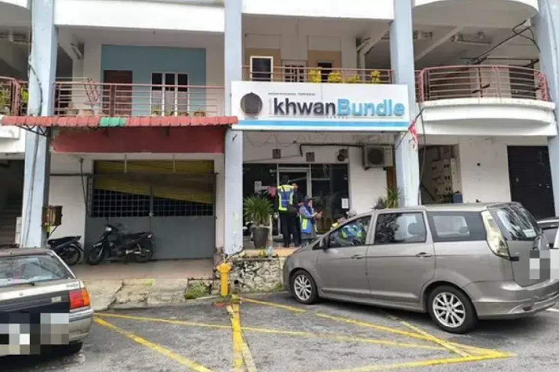 Police officers were seen outside a shop believed to be owned by GISB.