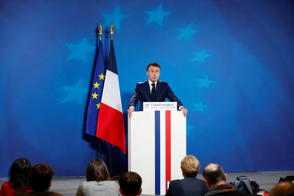 French President Emmanuel Macron attends a press conference in Brussels, Belgium October 17, 2024. REUTERS/Johanna Geron