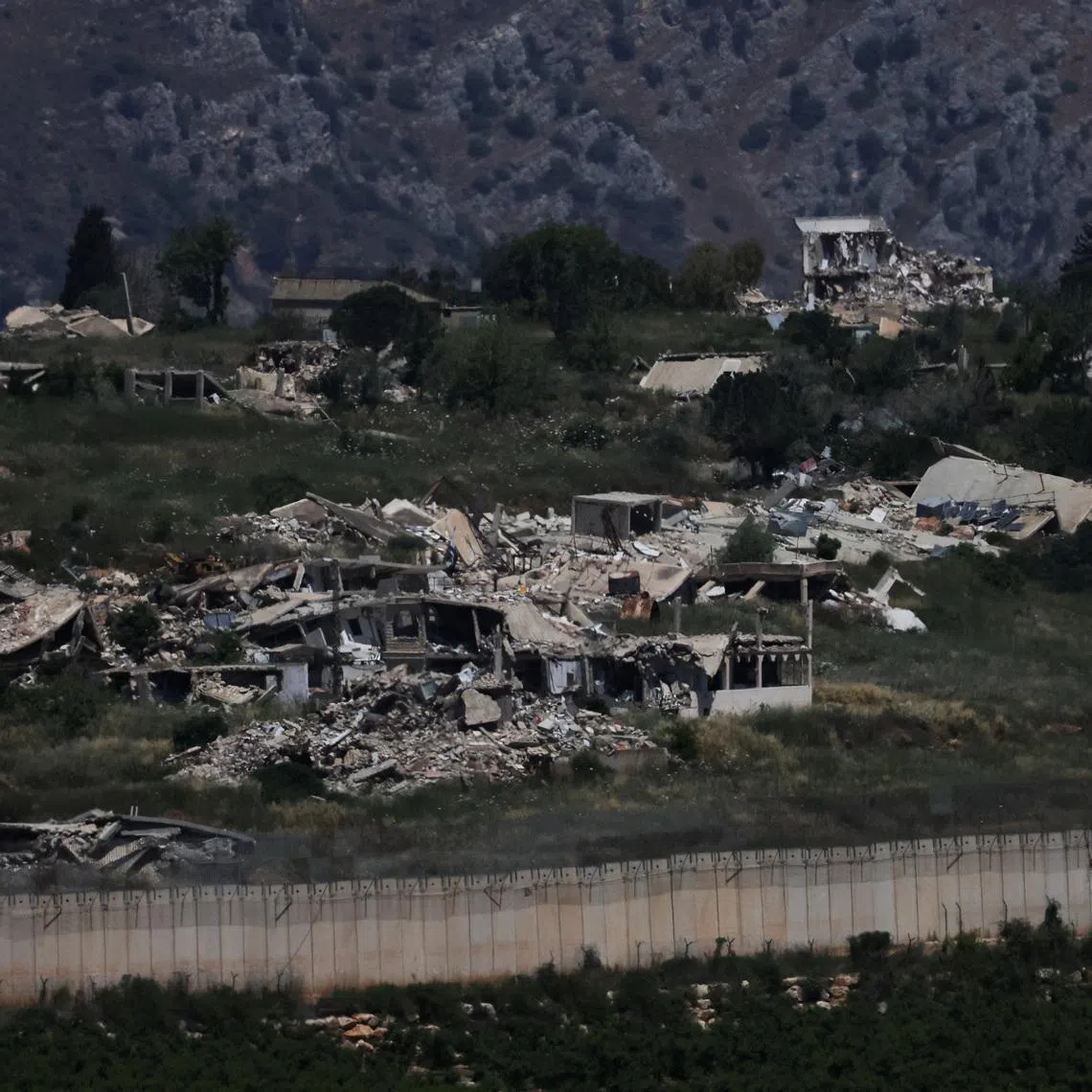 The remains of buildings in southern Lebanon, as seen from the Israeli side of the Israel-Lebanon border, in northern Israel, June 10, 2026. REUTERS/Ammar Awad