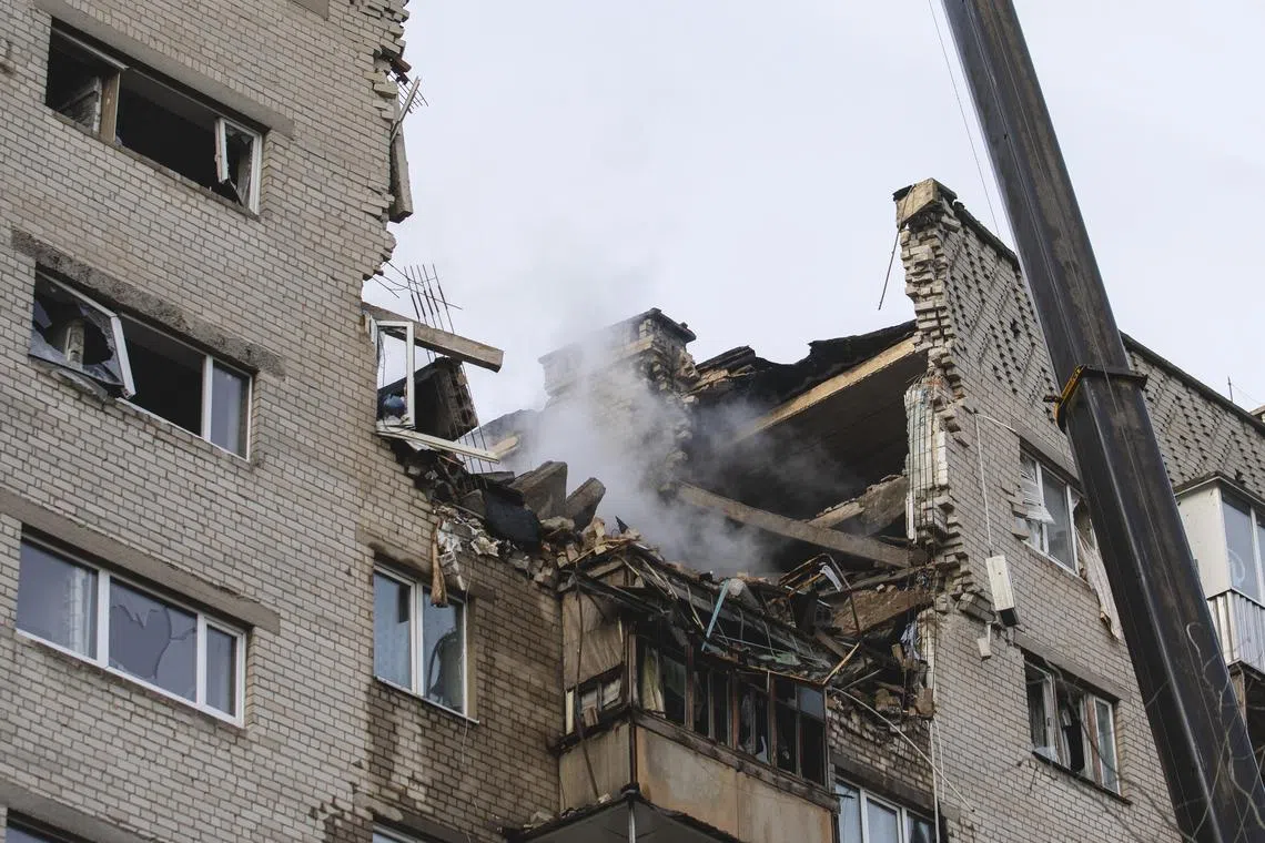 Rescuers work at the site of an overnight Russian drone attack on a residential building in Dnipro, in Ukraine's  Dnipropetrovsk region.
