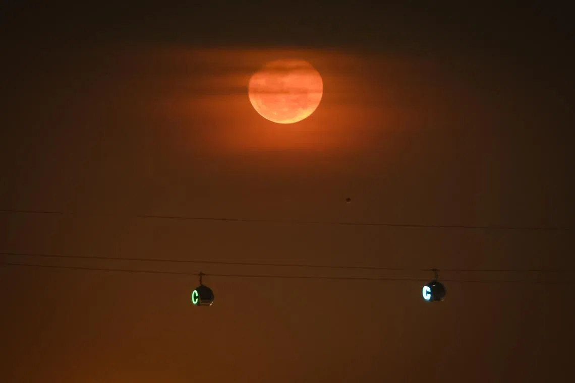 PIXGENERIC A waning gibbous moon rises over the eastern horizon above HarbourFront on May 4, 2026.
