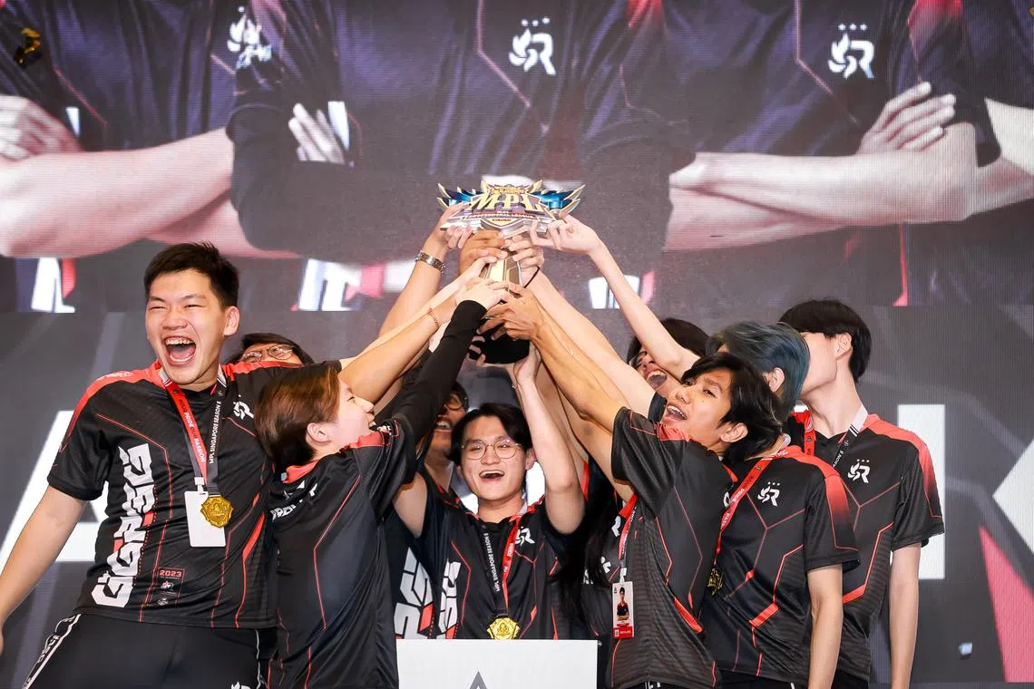 RSG Slate SG lifting the Mobile Legends: Bang Bang Professional League Singapore trophy after winning the title for the third consecutive time.