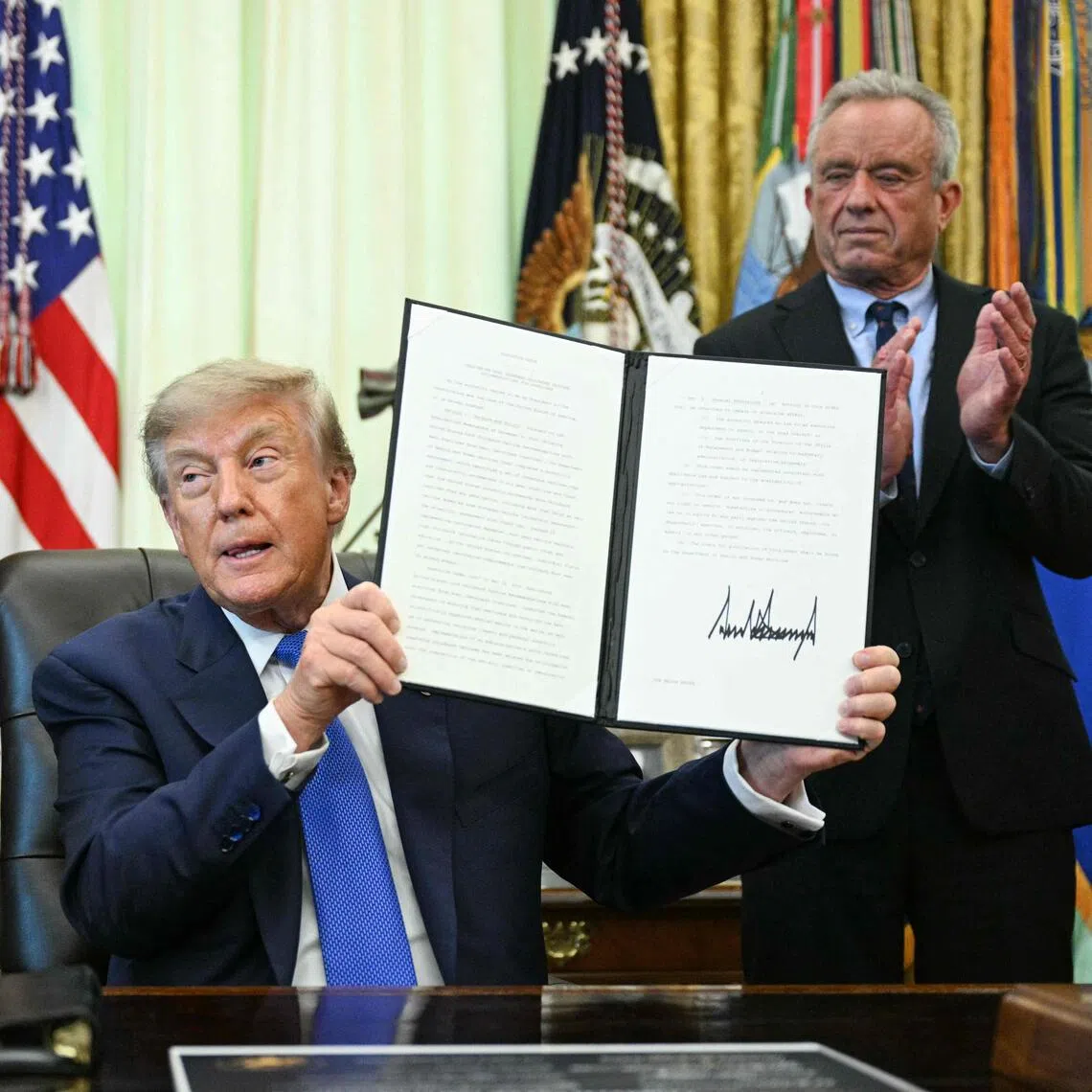 US President Donald Trump signs an executive order calling for more research and flexibility on vaccines.