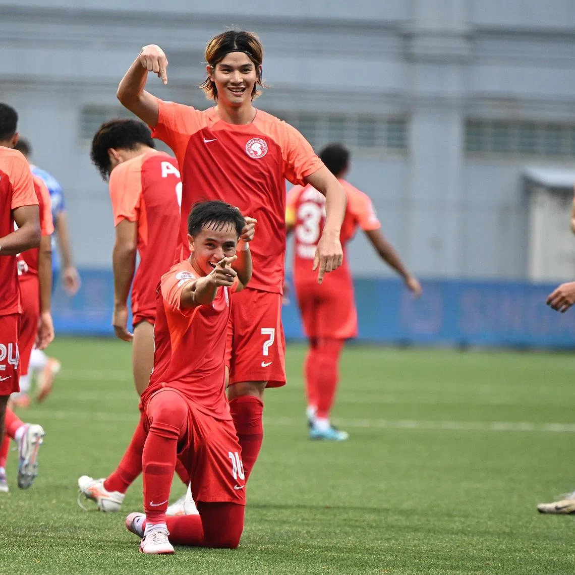 Goalscorers Kan Kobayashi (top) and Fathullah Rahmat celebrating a goal in the Young Lions' 4-4 draw with Hougang United.