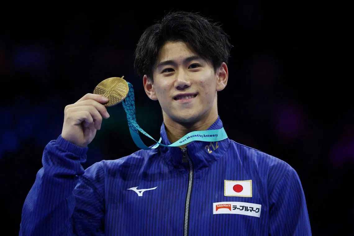 FILE PHOTO: Gymnastics - 2023 World Artistic Gymnastics Championships - Sportpaleis, Antwerp, Belgium - October 8, 2023 Gold medallist Japan's Daiki Hashimoto celebrates during the medal ceremony after winning the horizontal bar during the men's apparatus finals REUTERS/Yves Herman/File Photo