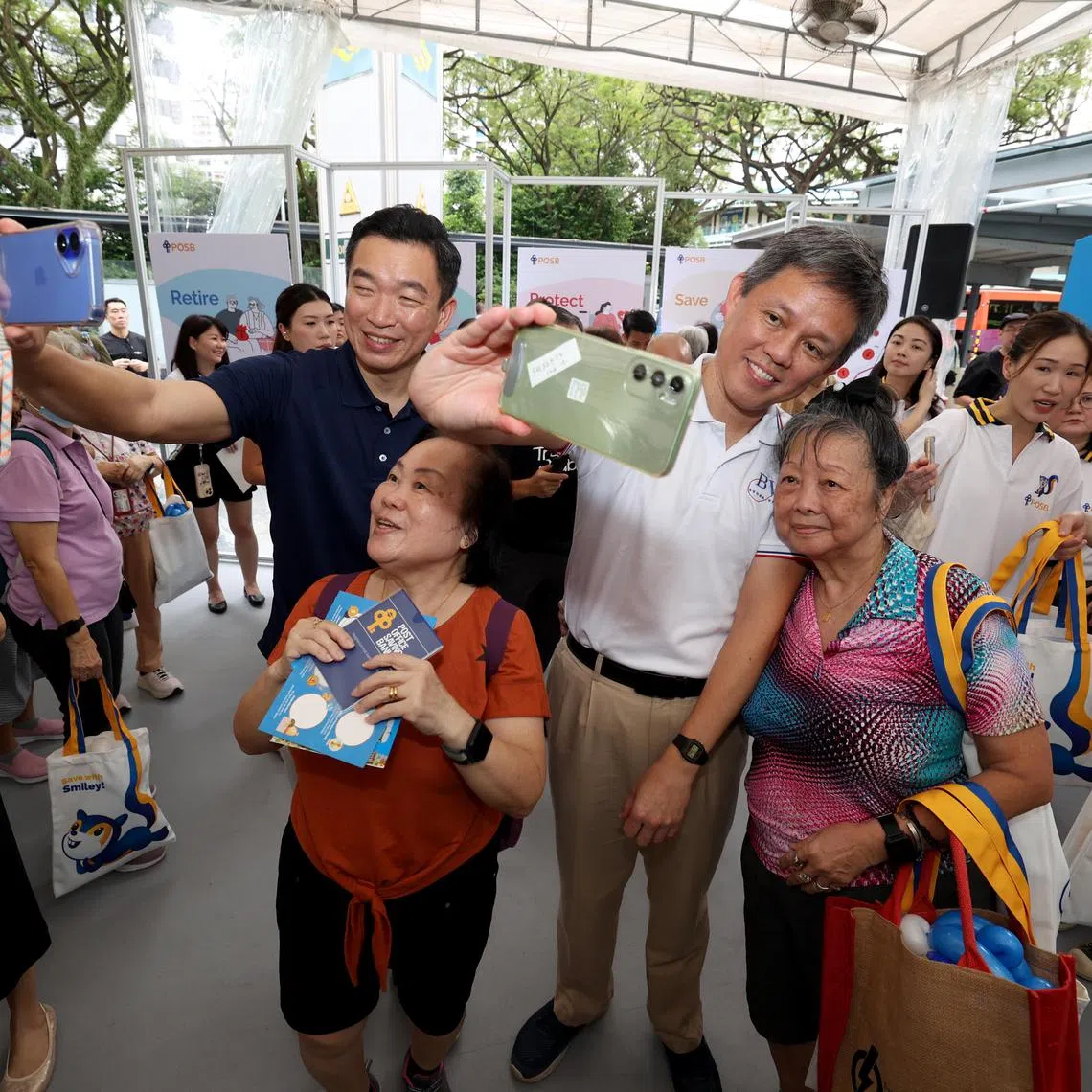 Senior Parliamentary Secretary for Culture, Community and Youth & Social and Family Development Eric Chua (left) and Education Minister Chan Chun Sing with participants at a DBS/POSB bank event on March 15.