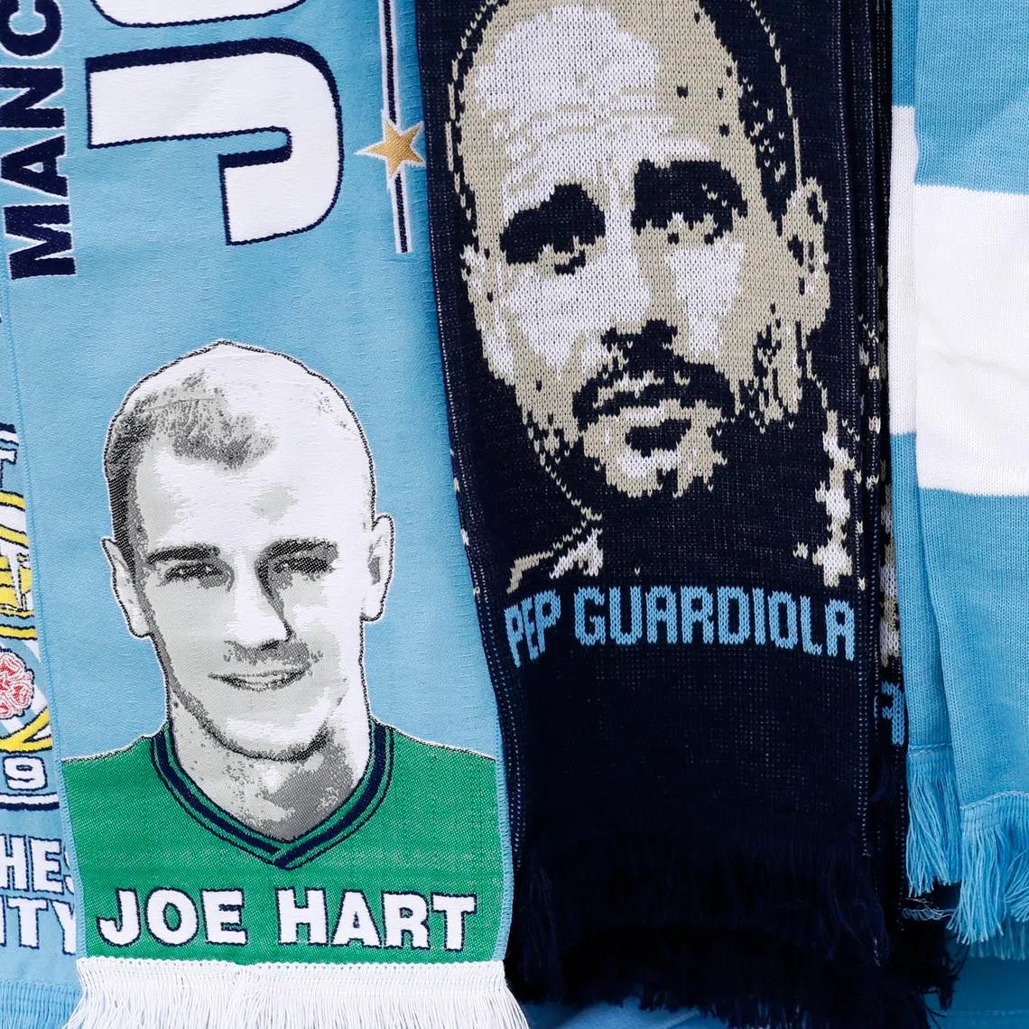 Britain Football Soccer - Manchester City v Everton - Premier League - Etihad Stadium - 15/10/16
Joe Hart and Pep Guardiola scarves for sale outside the stadium before the match 
Action Images via Reuters / Jason Cairnduff