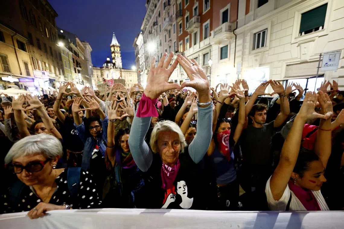 FILE PHOTO: Demonstrators raise their hands to symbolise the uterus, at a protest organized by Non Una di Meno (Not One Less) movement and feminist collectives, to mark International Safe Abortion Day, in Rome, Italy September 28, 2022. REUTERS/Yara Nardi/File Photo