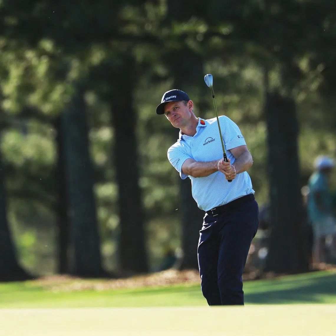 Golf - The Masters - Augusta National Golf Club, Augusta, Georgia, U.S. - April 9, 2026  England's Justin Rose chips onto the green of the 17th hole during the first round REUTERS/Mike Segar