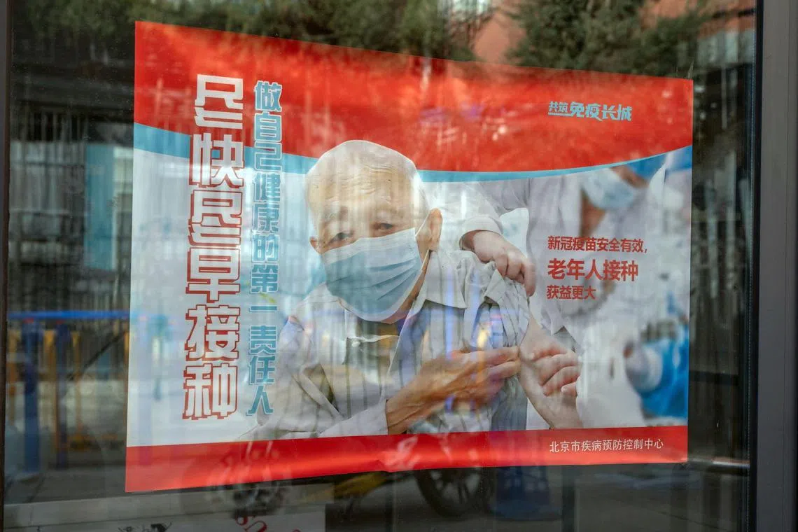 An advertisement on Covid vaccinations for elderly people in Beijing, China, on Thursday, Dec. 15, 2022. China's economic activity worsened in November before the government abruptly dropped its Covid Zero policy, with more disruption to growth likely as infections surge. Source: Bloomberg