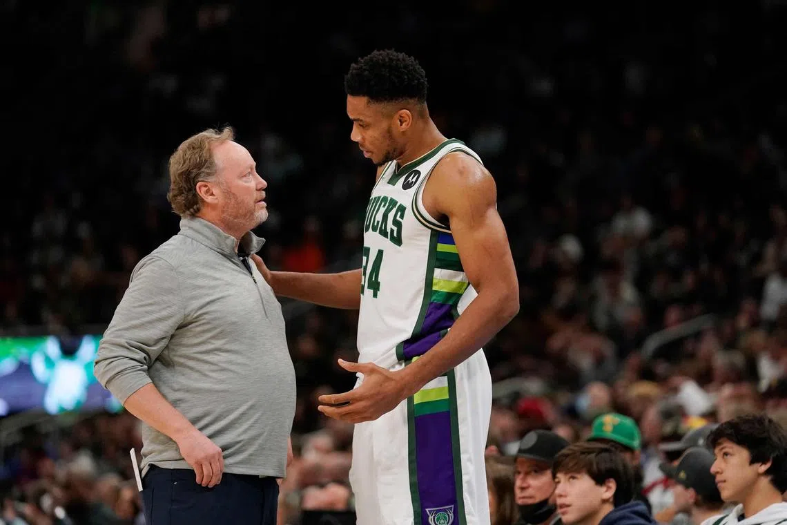 Giannis Antetokounmpo of the Milwaukee Bucks talking with then head coach Mike Budenholzer. ESPN reported that Budenholzer's likely replacement Adrian Griffin met with the Bucks superstar as part of the hiring process.