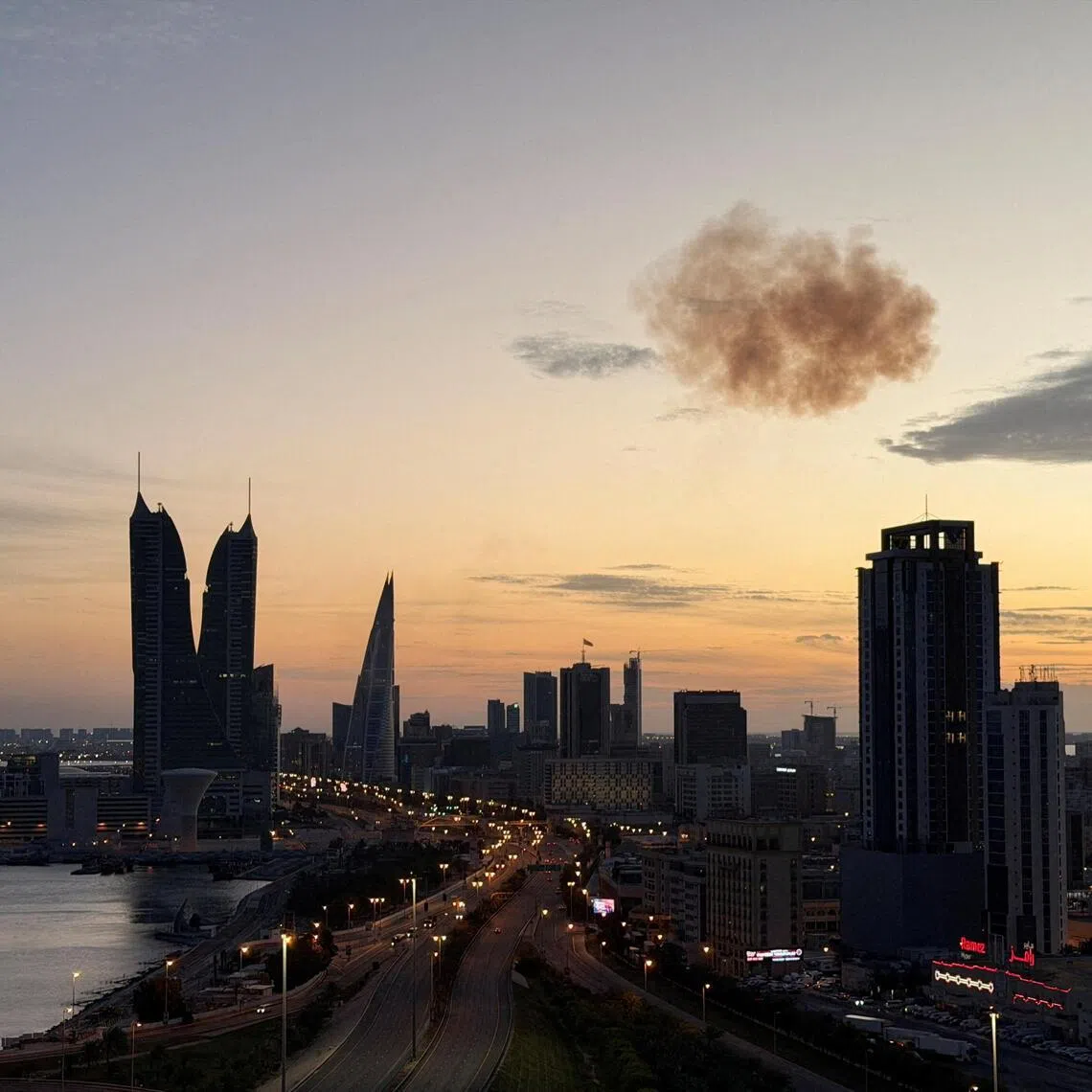 Smoke rises after an Iranian drone was intercepted over the Bahrain Financial Harbour towers, in Manama, on March 6. 