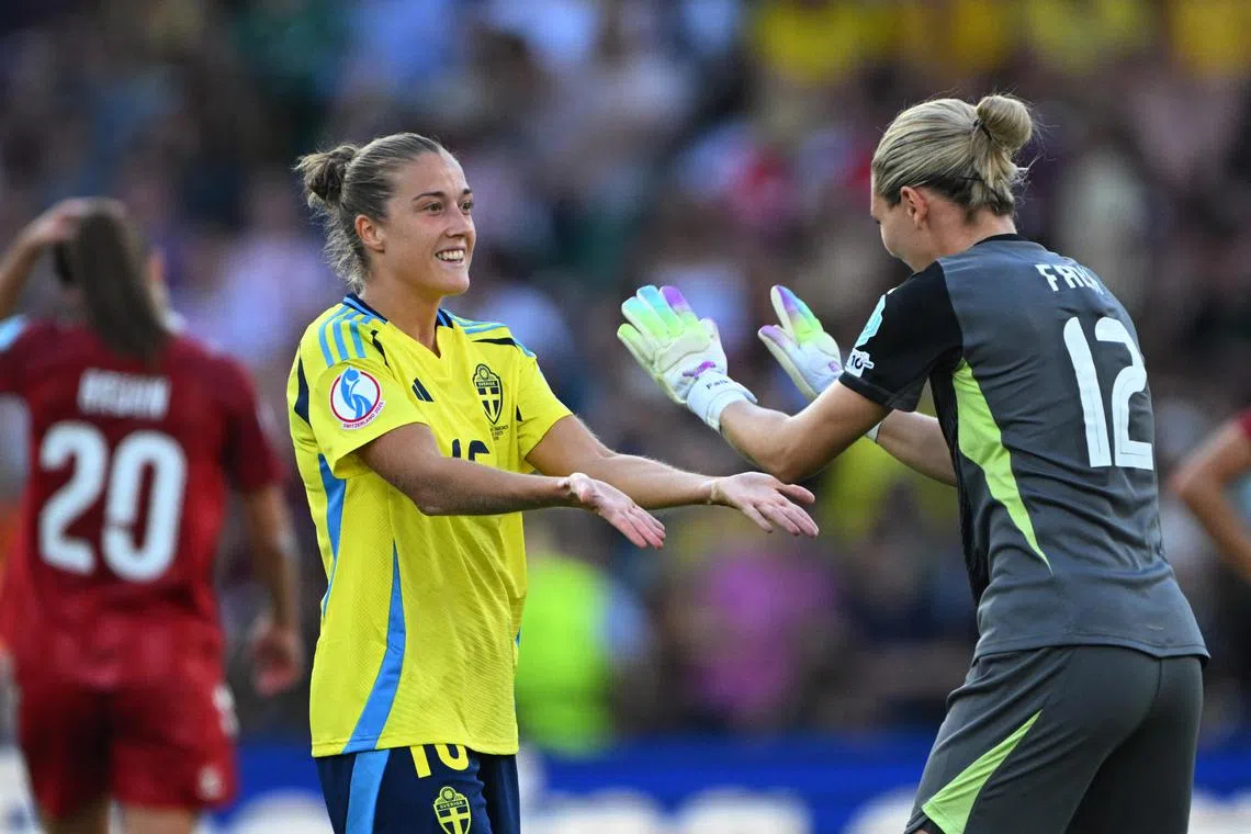 Sweden's Filippa Angeldahl and Jennifer Falk celebrate after the match.
