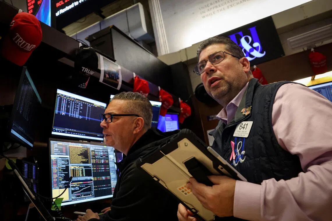 Traders working on the floor of the New York Stock Exchange, in New York City, on Nov 20.