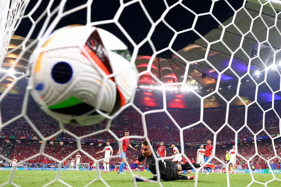 FILE PHOTO: Soccer Football - Euro 2024 - Group F - Czech Republic v Turkey - Hamburg Volksparkstadion, Hamburg, Germany - June 26, 2024 Turkey's Cenk Tosun scores their second goal past Czech Republic's Matej Kovar REUTERS/Lisi Niesner/File Photo