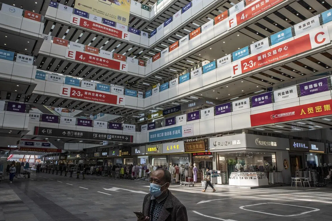 A deserted wholesale fabrics and accessories market in Guangzhou, China, Dec. 28, 2022. Years of lockdowns took a brutal toll on businesses in the city. Now, the rapid spread of Covid after a chaotic reopening has deprived them of workers and customers. (Gilles Sabrie/The New York Times)