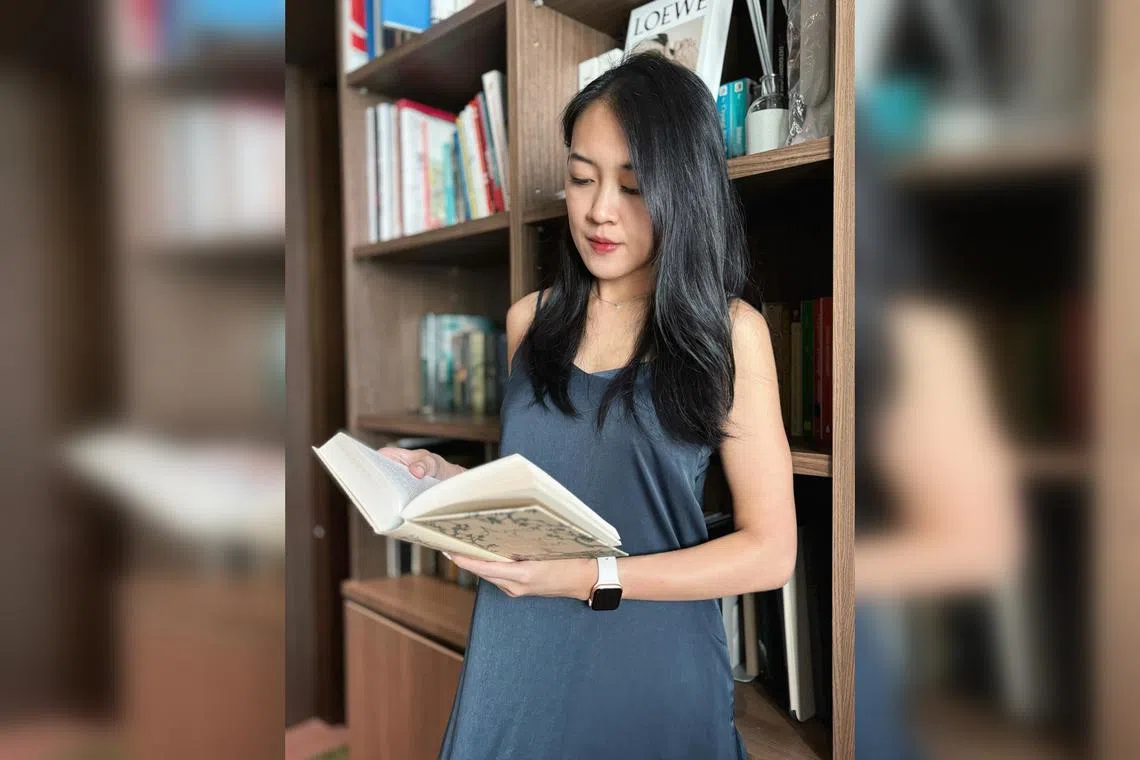 Small stationery and lifestyle business owner Aerilynn Tan reads two books at once, one fiction and one non-fiction. 