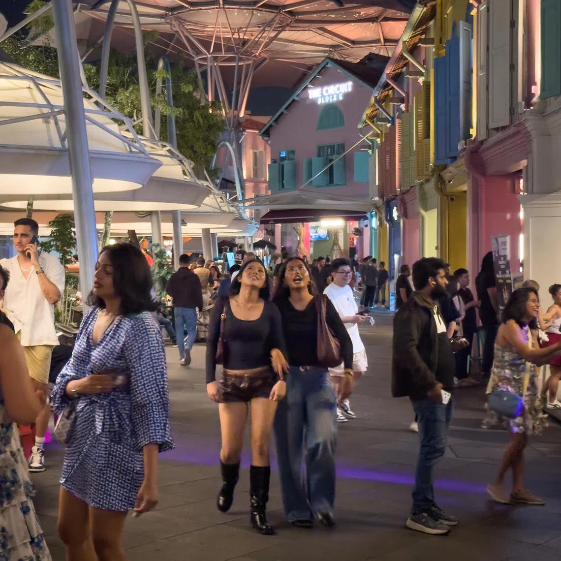 Patrons outside a pub at Clarke Quay on Aug 23, 2025.