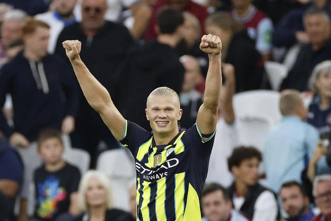 Manchester City's Erling Haaland celebrates scoring their third goal against West Ham.