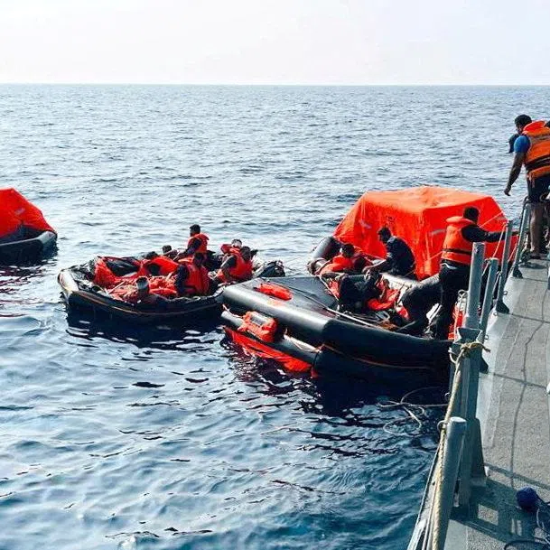Sri Lanka Navy personnel assist Iranian sailors during a rescue operation after responding to a distress call from their vessel, the Iranian military ship, IRIS Dena, while at sea within Sri Lanka’s maritime search and rescue region, in Indian Ocean, Sri Lanka, March 4, 2026. Sri Lanka Navy/Handout via REUTERS