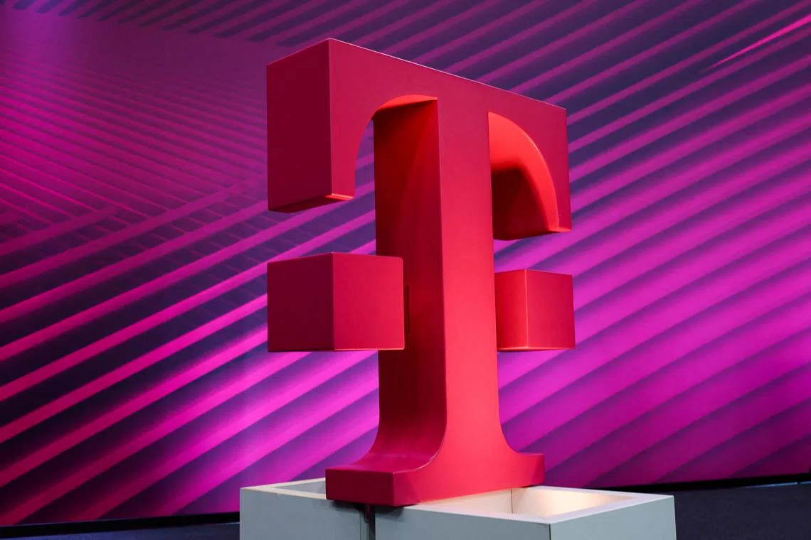 FILE PHOTO: A view shows the logo of telecommunications giant Deutsche Telekom AG during the company's annual news conference in Bonn, Germany, February 23, 2023. REUTERS/Wolfgang Rattay/File Photo