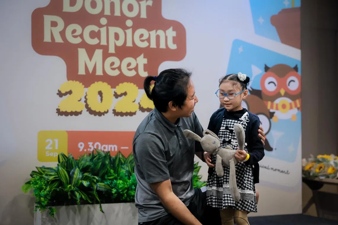 Mr Lim Wee Kiat meeting his bone marrow recipient Ho Wen Qing for the first time on Sept 21.