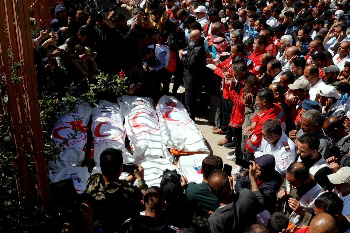 FILE PHOTO: Palestinians mourn medics, who came under Israeli fire while on a rescue mission, after their bodies were recovered, according to the Red Crescent, at Nasser hospital in Khan Younis in the southern Gaza Strip March 31, 2025. REUTERS/Hatem Khaled/File Photo