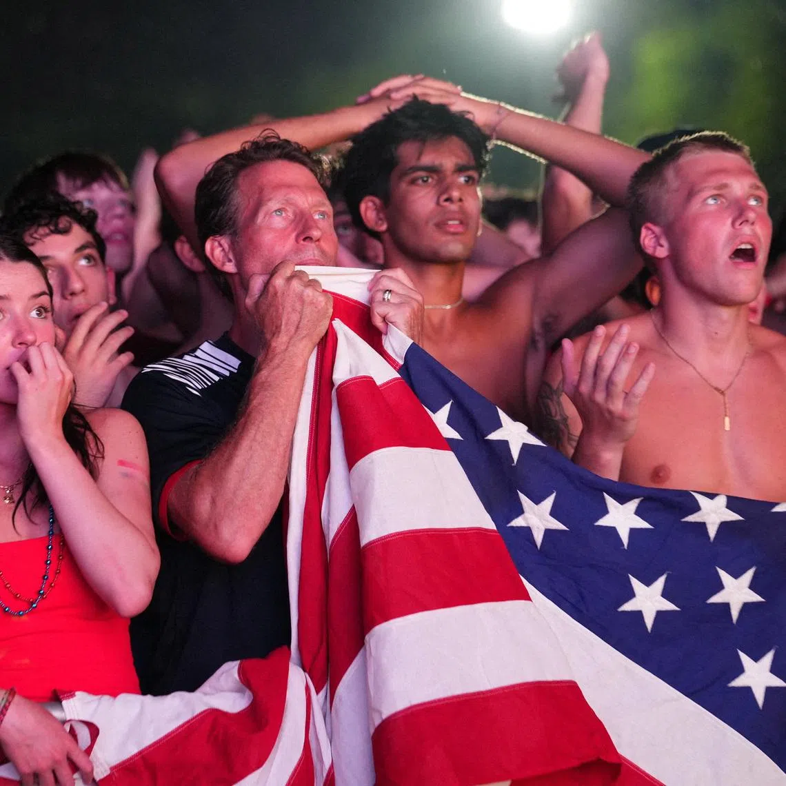Soccer Football - FIFA World Cup 2026 - Round of 16 - United States v Belgium - Fans gather in Washington, D.C. - Washington, D.C., U.S. - July 6, 2026 U.S. fans react as they watch the match on a big screen at the National Mall REUTERS/Eric Lee