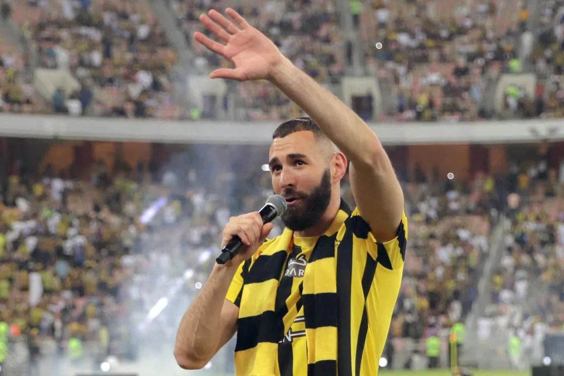 French forward Karim Benzema greeting the crowd during his unveiling as an Al Ittihad player at King Abdullah Sports City stadium in Jeddah, on June 8, 2023.  