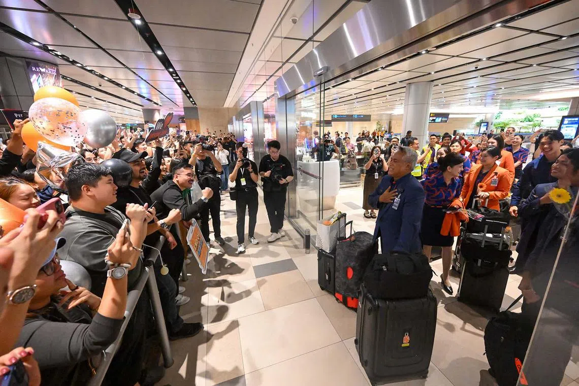 Customer service manager Norazman Sapiie and crew members were overwhelmed after being greeted by people who arrived at Changi Airport Terminal 4 to welcome the last scheduled Jetstar Asia flight on July 31, 2025.