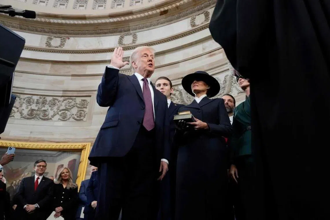 Mr Donald Trump is sworn in as the 47th US President in the Rotunda of the US Capitol in Washington.
