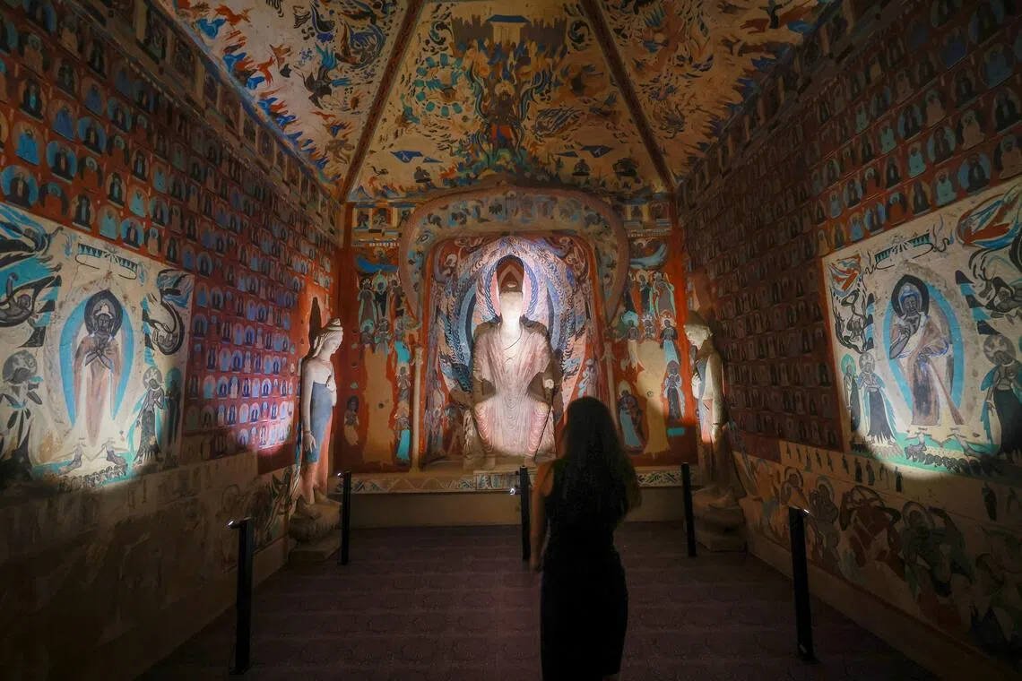 Murals from Cave 249 combine Buddhist, Taoist and Hindu imagery.