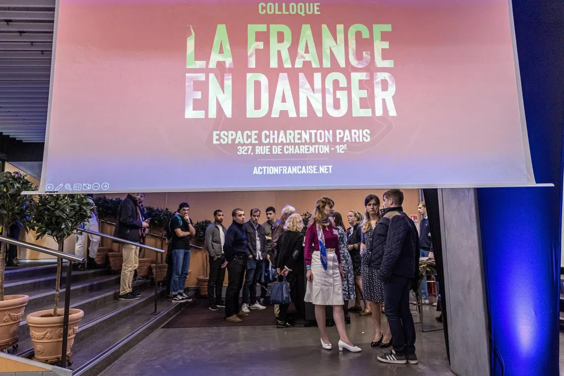 People queueing to enter a conference centre where the far-right and pro-monarchy party Action Francaise holds a meeting called ‘France in Danger’ in Paris on Saturday. 