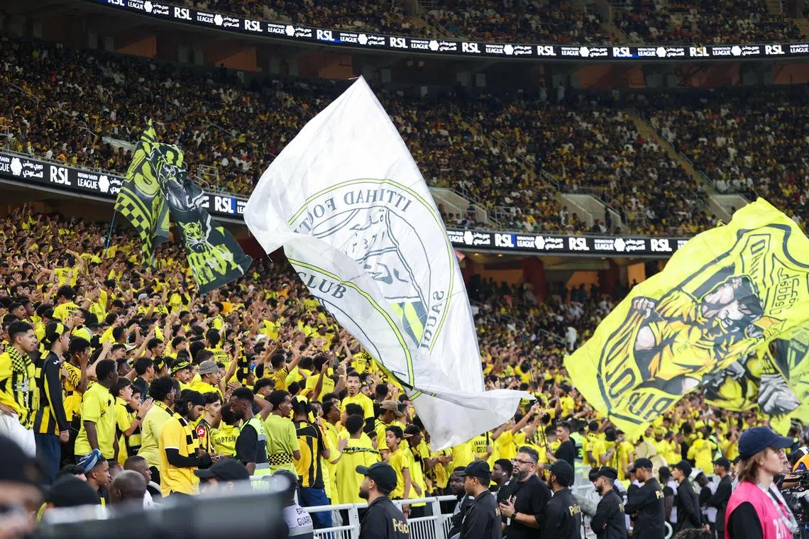 Al-Ittihad fans cheer ahead of the Saudi Pro League football match against Al-Nassr at King Abdullah Sports City in Jeddah on Dec 6, 2024.