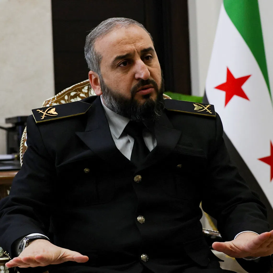 Syria's new defense minister Murhaf Abu Qasra attends an interview with Reuters in Damascus, Syria January 19, 2025. REUTERS/Yamam Al Shaar