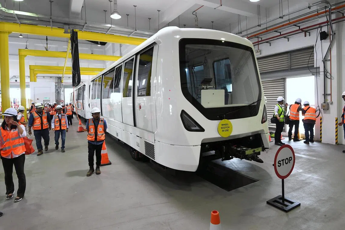 Members of the media viewing the new aerotrain during a test run at KLIA.
