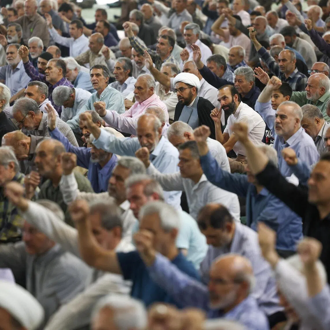 People attending Friday prayer in Tehran amid hopes Iran and the US will ink a peace deal by June 14.