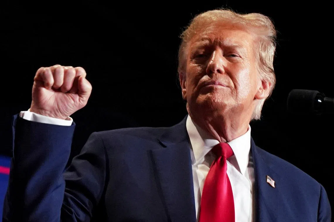 FILE PHOTO: Republican presidential candidate and former U.S. President Donald Trump reacts on stage during a campaign rally in Richmond, Virginia, U.S. March 2, 2024.  REUTERS/Jay Paul/File Photo