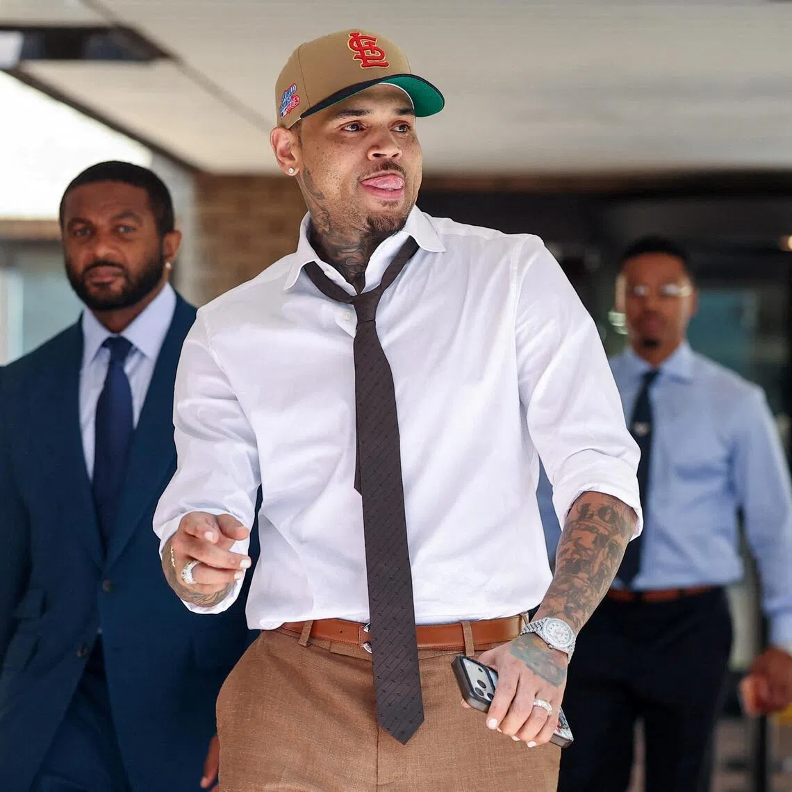 U.S. singer Chris Brown, who has been charged with inflicting grievous bodily harm in what prosecutors said was an "unprovoked attack" in a London nightclub in 2023, leaves Southwark Crown Court in London, Britain, July 24, 2026. REUTERS/Toby Melville