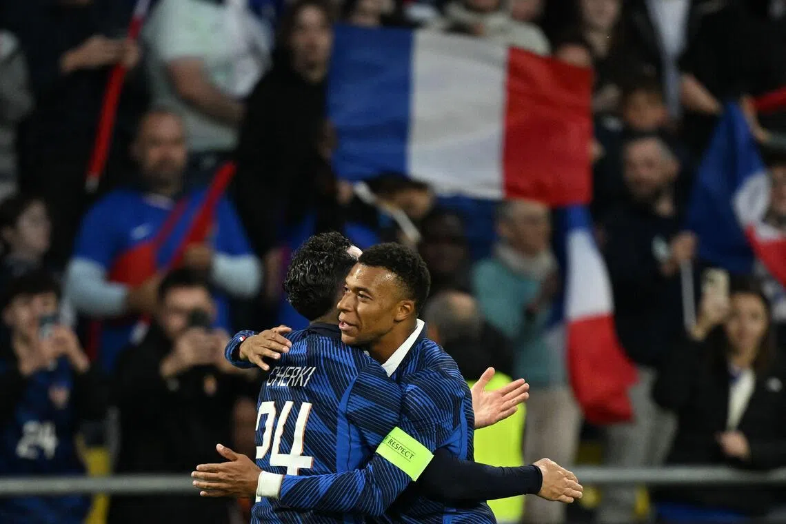 France's Rayan Cherki celebrates with captain Kylian Mbappe after scoring the opening goal during the international friendly football match between France and Ivory Coast ahead of the 2026 FIFA World Cup. 
