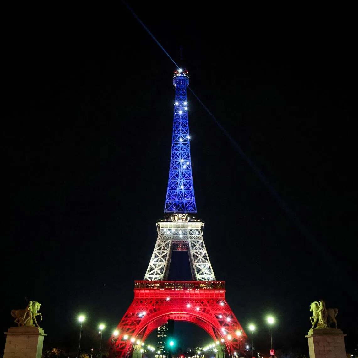 The Eiffel Tower illuminated in the colours of the French flag on Nov 12, ahead of the 10th anniversary of the Nov 13 terrorist attacks in Paris.