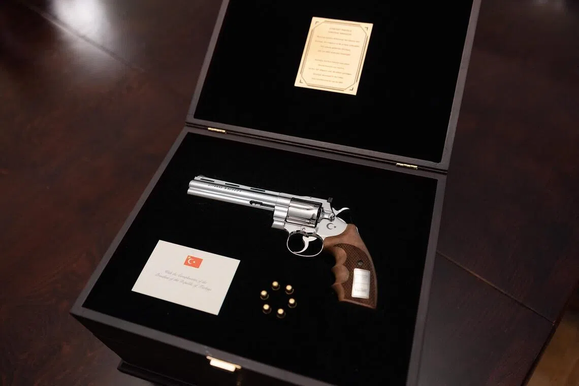 A photo from the office of the Lithuanian president showing the revolver offered by Turkish President Recep Tayyip Erdogan to Lithuanian President Gitanas Nauseda with the president’s name engraved on it, and live rounds. The weapon was displayed during a press presentation in Vilnius, Lithuania.