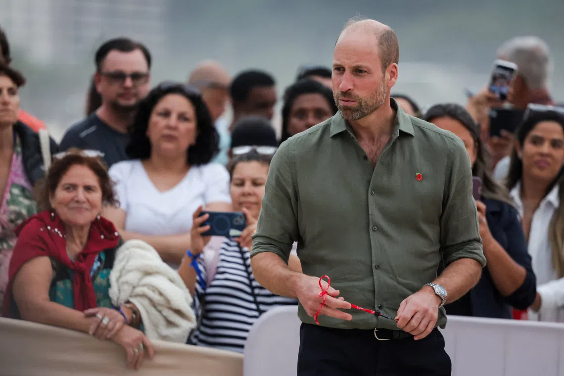 Britain's Prince William looks on as he meets with lifeguards and their students at Copacabana Beach, during an official visit in Rio de Janeiro, Brazil, November 3, 2025. REUTERS/Ricardo Moraes