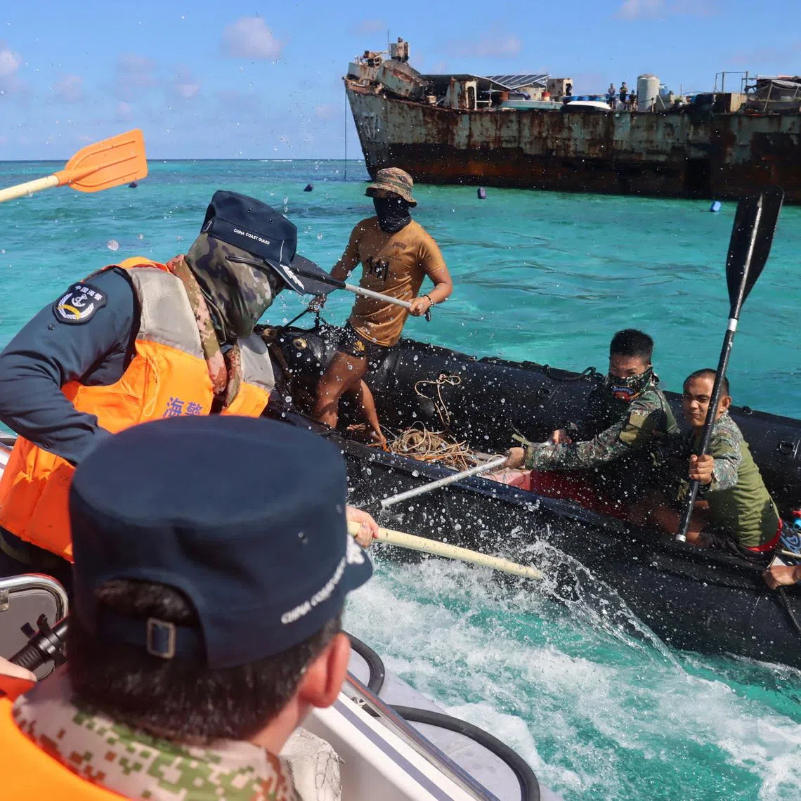 Philippine Navy personnel and China Coast Guard personnel clash near a grounded Philippine warship at Second Thomas Shoal, in the South China Sea, July 20, 2026. cnsphoto via REUTERS