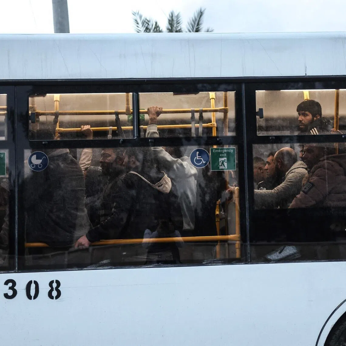 A bus carrying Kurdish fighters leaves Aleppo's Kurdish-majority Sheikh Maqsud neighbourhood on Jan 10.